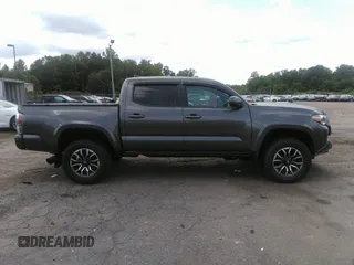 2021 Toyota Tacoma SR z VIN 3TYCZ5AN7MT017377, wystawiony jako IAAI lot #42285326 z przebiegiem 91 657 mil mil oraz . Historia ofert i sprzedaży dostępna na DreamBid. Obrazek 13.