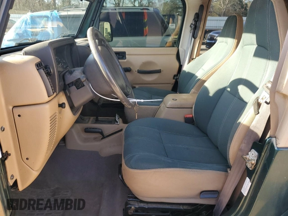2000 Jeep Wrangler Sahara with VIN 1J4FA59S0YP795198, listed as a Copart auction lot 87920205 with 150,148 mi miles and Salvage Title. Bid and sale history available at carsss.com. Image 7.