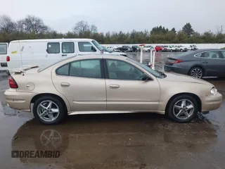 2003 Pontiac Grand Am SE1 with VIN 1G2NF52E03C327760, listed as a IAAI auction lot 41718054 with 156,173 mi miles. Bid and sale history available at carsss.com. Image 14.