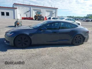 2022 Tesla Model S with VIN 5YJSA1E57NF479056, listed as a IAAI auction lot 42091009 with 78,272 mi miles and . Bid and sale history available at DreamBid. Image 14.