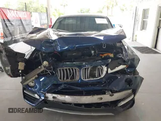 2015 BMW X4 xDrive28i with VIN 5UXXW3C51F0M87268, listed as a IAAI auction lot 42366363 with 143,285 mi miles and . Bid and sale history available at DreamBid. Image 6.