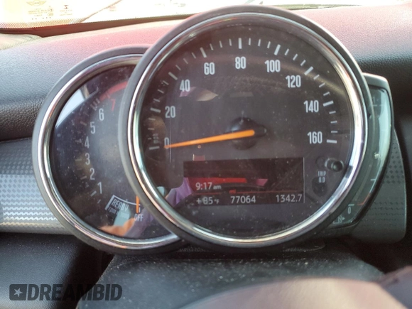 2021 MINI Hardtop Oxford Edition with VIN WMWXR3C09M2N13515, listed as a Copart auction lot 58490325 with 77,064 mi miles and Salvage title. Bid and sale history available at DreamBid. Image 9.