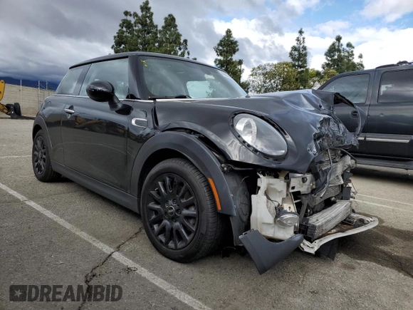 2019 MINI Hardtop Cooper with VIN WMWXP5C56K2H31697, listed as a Copart auction lot 48826655 with 60,190 mi miles and Salvage title. Bid and sale history available at DreamBid. Image 4.