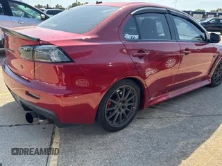 2012 Mitsubishi Lancer Evolution GSR z VIN JA32W8FV0CU019216, wystawiony jako Copart lot #75898944 z przebiegiem 129 387 mil mil oraz Tytuł czysty. Historia ofert i sprzedaży dostępna na DreamBid. Obrazek 4.
