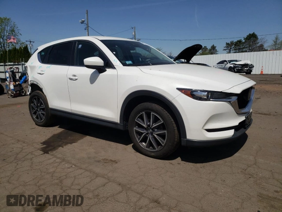 2018 Mazda CX-5 Touring with VIN JM3KFBCMXJ0389773, listed as a Copart auction lot 54737795 with 82,103 mi miles and Salvage Title. Bid and sale history available at DreamBid. Image 4.