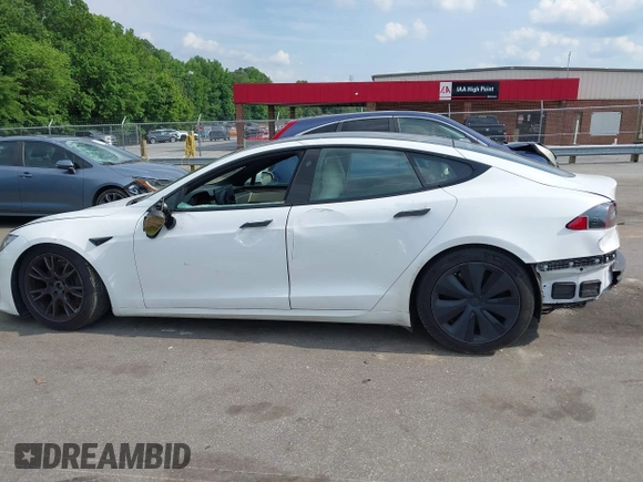 2022 Tesla Model S with VIN 5YJSA1E57NF462175, listed as a IAAI auction lot 42231439 with Not provided miles and . Bid and sale history available at DreamBid. Image 14.