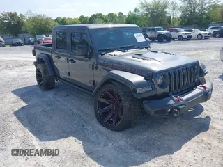 2020 Jeep Gladiator Rubicon with VIN 1C6JJTBG0LL187537, listed as a IAAI auction lot 42018914 with 53,443 mi miles and . Bid and sale history available at DreamBid. Image 1.