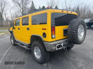 2003 Hummer H2 with VIN 5GRGN23UX3H112710, listed as a Copart auction lot 53854185 with 64,686 mi miles and Salvage Title. Bid and sale history available at carsss.com. Image 3.