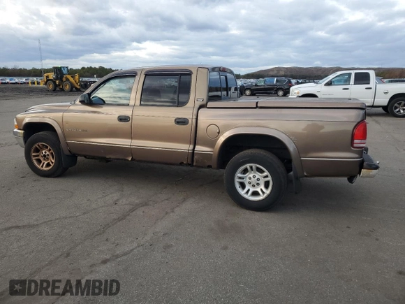 2001 Dodge Dakota z VIN 1B7GG2AX11S108005, wystawiony jako Copart lot #87124934 z przebiegiem 248 482 mil mil oraz Czysty tytuł • Clean title. Historia ofert i sprzedaży dostępna na DreamBid. Obrazek 2.