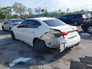 2015 Infiniti Q50 Premium z VIN JN1BV7AR5FM415612, wystawiony jako IAAI lot #41726943 z przebiegiem 120 534 mil mil oraz . Historia ofert i sprzedaży dostępna na DreamBid. Obrazek 3.