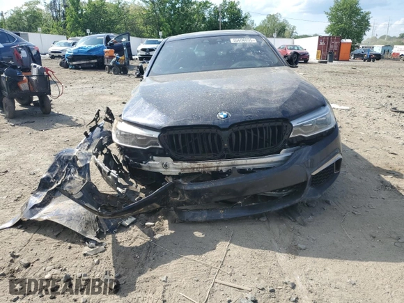 2020 BMW 5 Series M550i xDrive with VIN WBAJS7C03LCD00279, listed as a Copart auction lot 55698035 with 76,057 mi miles and Clean title. Bid and sale history available at DreamBid. Image 5.