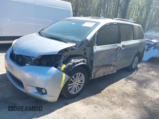 2015 Toyota Sienna XLE with VIN 5TDYK3DC0FS558486, listed as a IAAI auction lot 42064281 with 211,119 mi miles and . Bid and sale history available at DreamBid. Image 2.