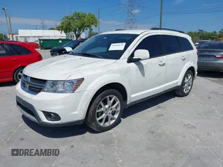2014 Dodge Journey SXT with VIN 3C4PDCBG4ET235848, listed as a IAAI auction lot 41824155 with 48,691 mi miles and . Bid and sale history available at DreamBid. Image 2.