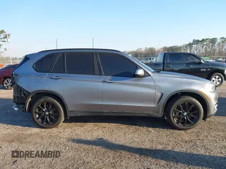 2016 BMW X5 xDrive40e with VIN 5UXKT0C57G0S75476, listed as a IAAI auction lot 41642249 with 105,489 mi miles and . Bid and sale history available at DreamBid. Image 14.