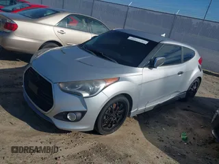 2013 Hyundai Veloster Turbo with VIN KMHTC6AE5DU112756, listed as a IAAI auction lot 42854505 with 99,015 mi miles and . Bid and sale history available at DreamBid. Image 2.