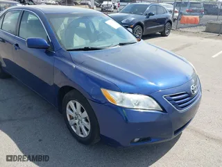 2007 Toyota Camry CE with VIN JTNBE46K373056707, listed as a IAAI auction lot 42128026 with 242,887 mi miles. Bid and sale history available at carsss.com. Image 6.