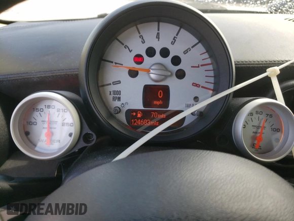 2012 MINI Hardtop with VIN WMWSU3C52CT367682, listed as a Copart auction lot 63045965 with 124,683 mi miles and Salvage title. Bid and sale history available at DreamBid. Image 9.