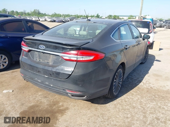 2017 Ford Fusion Titanium with VIN 3FA6P0K9XHR118057, listed as a IAAI auction lot 41982261 with 151,704 mi miles. Bid and sale history available at carsss.com. Image 4.