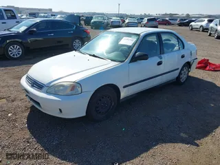 2000 Honda Civic LX with VIN 2HGEJ6673YH502410, listed as a IAAI auction lot 41992745 with 173,958 mi miles. Bid and sale history available at carsss.com. Image 2.