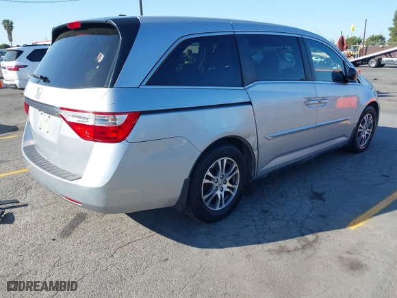 2011 Honda Odyssey EX-L with VIN 5FNRL5H62BB010876, listed as a IAAI auction lot 41981812 with 195,734 mi miles. Bid and sale history available at carsss.com. Image 4.