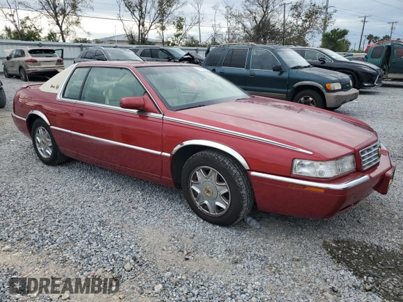 2001 Cadillac Eldorado ESC z VIN 1G6EL12Y11B103541, wystawiony jako Copart lot #45219055 z przebiegiem 46 179 mil mil oraz Tytuł czysty. Historia ofert i sprzedaży dostępna na DreamBid. Obrazek 4.