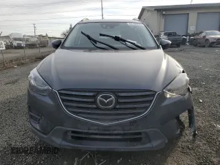 2016 Mazda CX-5 Grand Touring with VIN JM3KE4DY0G0876540, listed as a Copart auction lot 42132815 with 110,158 mi miles and Salvage Title. Bid and sale history available at DreamBid. Image 5.