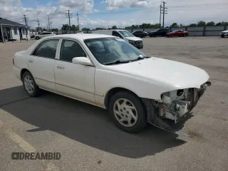2000 Mazda 626 LX z VIN 1YVGF22C3Y5165341, wystawiony jako Copart lot #56575075 z przebiegiem 58 645 mil mil oraz Szkody całkowita. Historia ofert i sprzedaży dostępna na DreamBid. Obrazek 4.