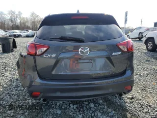 2014 Mazda CX-5 Grand Touring with VIN JM3KE2DY4E0323603, listed as a Copart auction lot 49884835 with 0 mi miles and Salvage Title. Bid and sale history available at carsss.com. Image 6.
