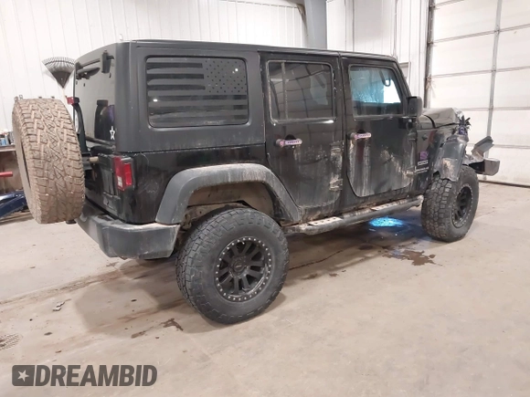 2017 Jeep Wrangler Unlimited Sport with VIN 1C4BJWDGXHL698014, listed as a IAAI auction lot 41384325 with 121,402 mi miles. Bid and sale history available at carsss.com. Image 4.