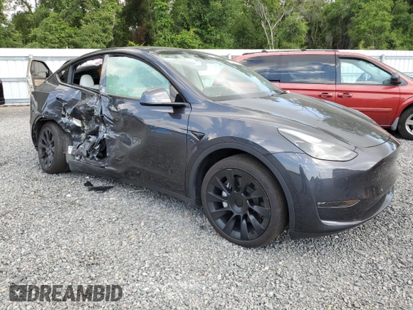 2024 Tesla Model Y Long Range with VIN 7SAYGDEE4RA285620, listed as a Copart auction lot 57883015 with 18,841 mi miles and Salvage title. Bid and sale history available at DreamBid. Image 4.