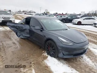 2023 Tesla Model 3 Performance with VIN 5YJ3E1EC6PF590739, listed as a IAAI auction lot 40919165 with 20,474 mi miles. Bid and sale history available at carsss.com. Image 1.