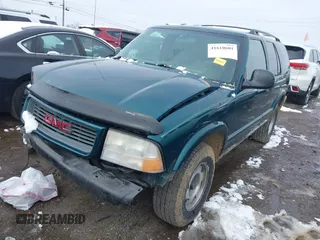 1998 GMC Jimmy SL with VIN 1GKCS13W4W2562613, listed as a IAAI auction lot 41610601 with 1 mi miles. Bid and sale history available at carsss.com. Image 2.