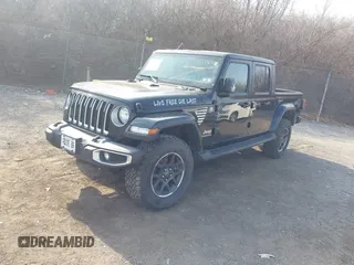 2021 Jeep Gladiator Overland z VIN 1C6HJTFG1ML606215, wystawiony jako IAAI lot #41771646 z przebiegiem 77 411 mil mil oraz . Historia ofert i sprzedaży dostępna na DreamBid. Obrazek 19.