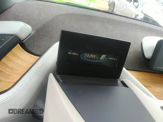 2014 BMW i3 with VIN WBY1Z4C57EV276421, listed as a IAAI auction lot 42667600 with 82,105 mi miles and . Bid and sale history available at DreamBid. Image 7.