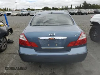 2005 Infiniti Q45 z VIN JNKBF01A85M101123, wystawiony jako Copart lot #72220124 z przebiegiem 111 464 mil mil oraz Szkody całkowita. Historia ofert i sprzedaży dostępna na DreamBid. Obrazek 6.