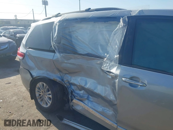 2014 Toyota Sienna XLE with VIN 5TDYK3DC8ES423450, listed as a IAAI auction lot 41972128 with 145,374 mi miles. Bid and sale history available at carsss.com. Image 6.