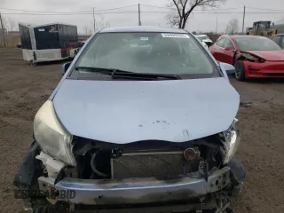 2012 Toyota Yaris L with VIN JTDKTUD33CD517298, listed as a Copart auction lot 52099335 with Not Provided miles and Salvage Title. Bid and sale history available at DreamBid. Image 5.