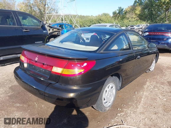 1997 Saturn SC z VIN 1G8ZE1283VZ163658, wystawiony jako IAAI lot #40494467 z przebiegiem 111 701 mil mil oraz . Historia ofert i sprzedaży dostępna na DreamBid. Obrazek 4.
