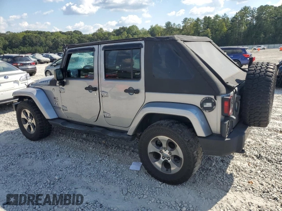 2018 Jeep Wrangler JK Unlimited Sahara with VIN 1C4HJWEG5JL801886, listed as a Copart auction lot 73849454 with 111,016 mi miles and Salvage Title. Bid and sale history available at carsss.com. Image 2.