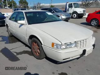 1996 Cadillac Seville Touring STS with VIN 1G6KY5298TU815539, listed as a IAAI auction lot 41665242 with 151,736 mi miles. Bid and sale history available at carsss.com. Image 1.
