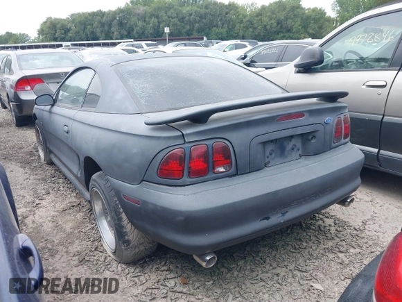 1997 Ford Mustang with VIN 1FALP4043VF158166, listed as a IAAI auction lot 39369761 with 124,992 mi miles. Bid and sale history available at carsss.com. Image 3.