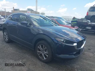 2021 Mazda CX-30 Premium z VIN 3MVDMBDM5MM216605, wystawiony jako IAAI lot #42514498 z przebiegiem 34 999 mil mil oraz . Historia ofert i sprzedaży dostępna na DreamBid. Obrazek 1.