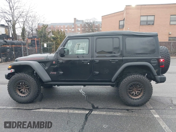 2022 Jeep Wrangler Unlimited Rubicon with VIN 1C4HJXFGXNW127064, listed as a IAAI auction lot 41491203 with 47,700 mi miles and . Bid and sale history available at DreamBid. Image 14.