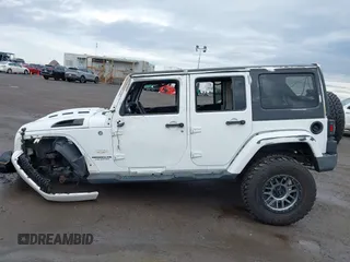 2015 Jeep Wrangler Unlimited Sahara with VIN 1C4BJWEG5FL518191, listed as a IAAI auction lot 41914581 with 107,433 mi miles. Bid and sale history available at carsss.com. Image 14.