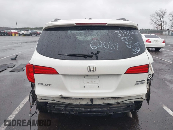 2016 Honda Pilot Touring with VIN 5FNYF6H95GB062089, listed as a IAAI auction lot 41810378 with 74,704 mi miles and . Bid and sale history available at DreamBid. Image 16.