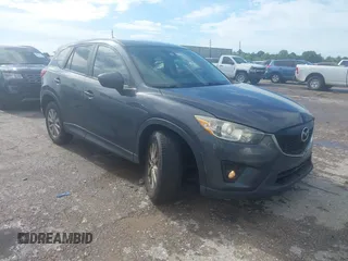 2014 Mazda CX-5 Touring z VIN JM3KE2CY0E0333725, wystawiony jako IAAI lot #42359725 z przebiegiem 141 791 mil mil oraz . Historia ofert i sprzedaży dostępna na DreamBid. Obrazek 1.
