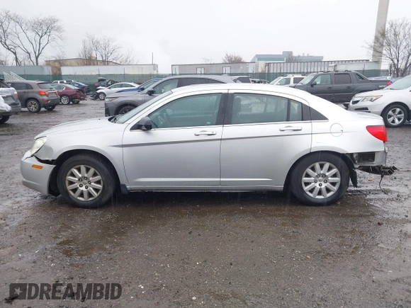 2010 Chrysler Sebring Touring z VIN 1C3CC4FB5AN128652, wystawiony jako IAAI lot #41863619 z przebiegiem 123 698 mil mil oraz . Historia ofert i sprzedaży dostępna na DreamBid. Obrazek 13.
