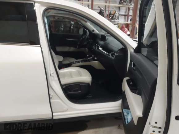 2020 Mazda CX-5 Grand Touring with VIN JM3KFBDM6L1828611, listed as a IAAI auction lot 42006976 with 59,939 mi miles and . Bid and sale history available at DreamBid. Image 5.
