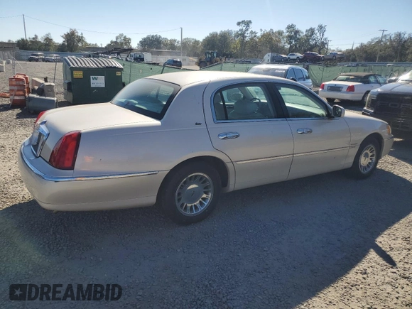 2001 Lincoln Town Car Cartier z VIN 1LNHM83W31Y671814, wystawiony jako Copart lot #77169664 z przebiegiem Nie podano mil oraz Szkoda całkowita • Salvage title. Historia ofert i sprzedaży dostępna na DreamBid. Obrazek 3.