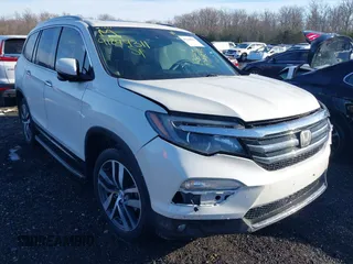 2017 Honda Pilot Touring with VIN 5FNYF6H98HB102313, listed as a IAAI auction lot 41244311 with 106,931 mi miles. Bid and sale history available at carsss.com. Image 1.
